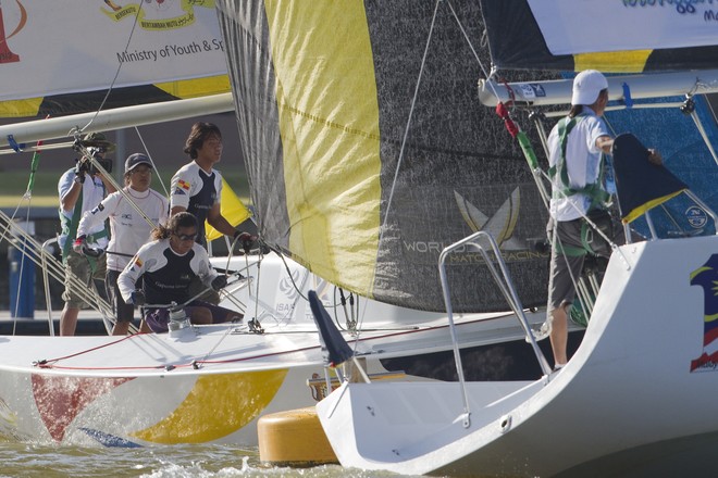 Tiffany Koo dips the stern of her brother Jeremy during the finals at the Malaysian Match Racing Championships 2010. Kuala Terengannu, Malaysia. 23 October 2010. Photo: Subzero Images/Monsoon Cup © Gareth Cooke Subzero Images/Monsoon Cup http://www.monsooncup.com.my