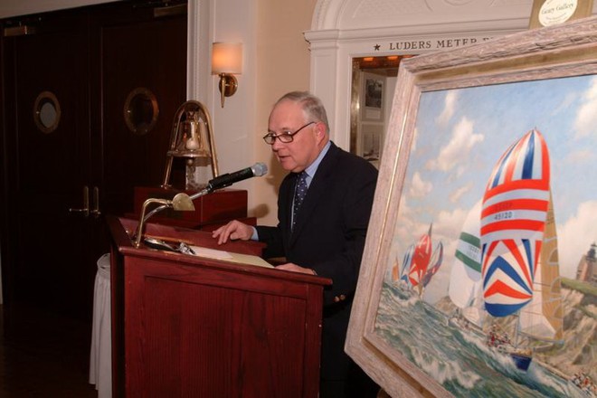 Storm Trysail Foundation Chairman John Fisher, with the Storm Trysail Foundation Award in the background, addresses the audience gathered to honor Ted Turner and his Tenacious crew.  In the foreground is a Christie’s auction item: an original A.D. Blake (brother of Sir Peter Blake) painting commissioned by Storm Trysail Club in the early ‘90s to commemorate Block Island Race Week. © Storm Trysail Foundation www.stormtrysailfoundation.org