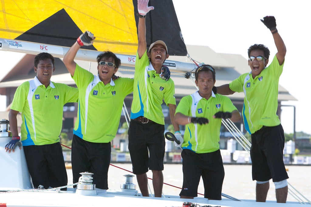 Hazwan Hazim and his Taring Pelangi team celebrate after winning the Malaysian Match Racing Championships 2009. Kuala Terengganu, Malaysia. 26 November 2009. Photo: Gareth Cooke/Subzero Images © Gareth Cooke Subzero Images/Monsoon Cup http://www.monsooncup.com.my