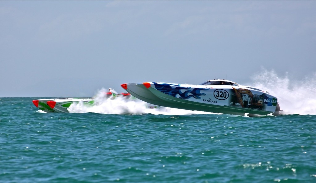 Doosan (right) passes A1 Homes to the way to winning the 100-mile NZOPA race at Gulf Harbour - Rayglass NZ Offshore Powerboat Championship photo copyright Cathy Vercoe LuvMyBoat.com http://www.luvmyboat.com taken at  and featuring the  class