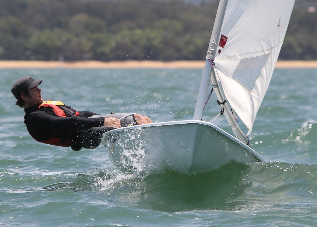 Brendan Torpelund from Townsville Sailing Club working hard to preserve his lead in his full rig Laser. - Zhik Mission Beach Sailing Regatta © Tom Orr