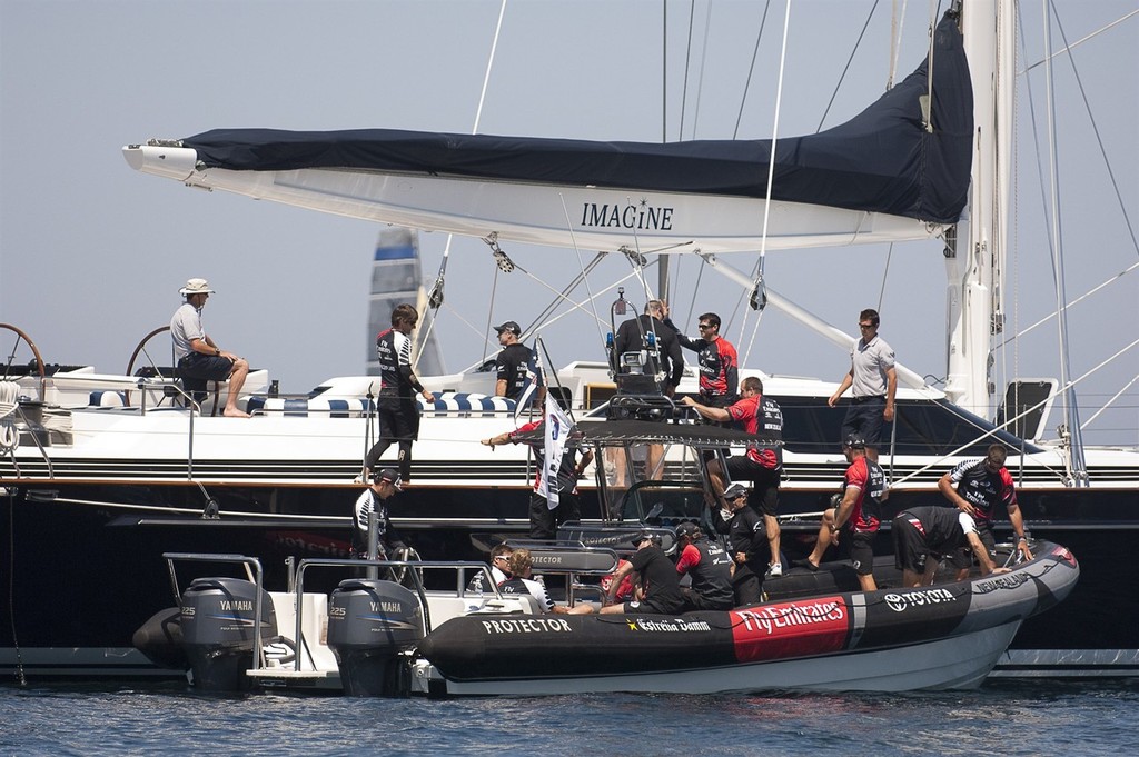 Emirates Team New Zealand sailors board the yacht Imagine to wait for the start of their first race of the regatta. Unfortunately the wind died out and racing was abanfoned. Day two of the Louis Vuitton Trophy, La Maddalena. Sardinia, Italy. 23/5/2010 © Chris Cameron/ETNZ http://www.chriscameron.co.nz