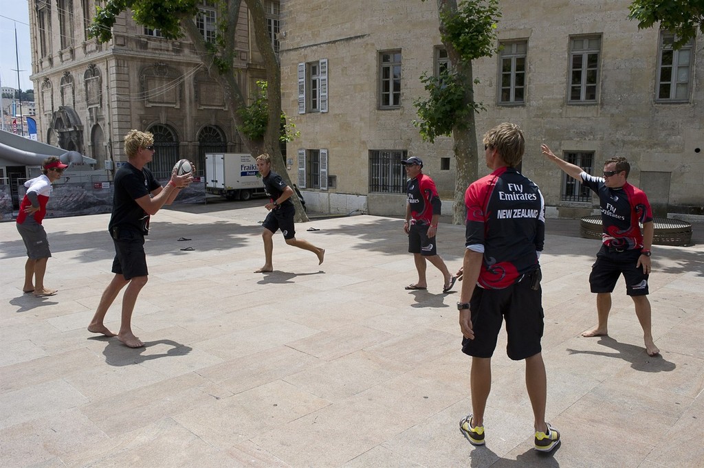 Emirates Team New Zealand shorecrew play touch rugby during the  postponement while the race comitee wait to see if the strong winds will subside sufficiently to race. Audi MedCup Marseille, France. 19/6/2010 © Chris Cameron/ETNZ http://www.chriscameron.co.nz