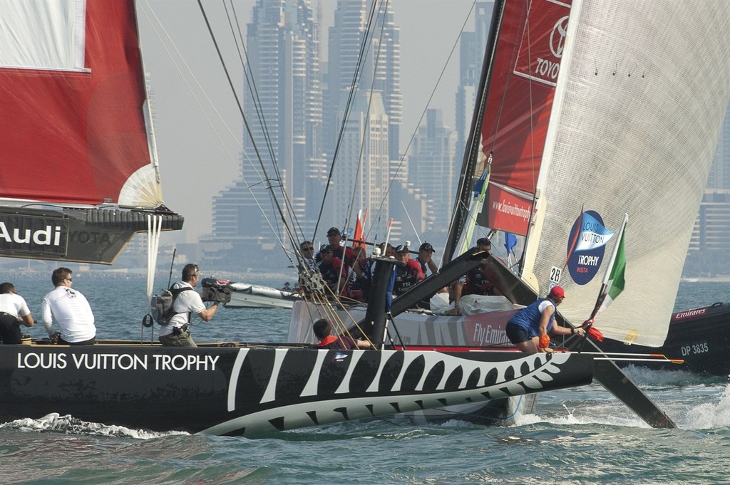 Gavin Brady gets a double penalty for Mascalzone Latino (ITA) in this collision with Emirates Team New Zealand in their second race. Day one of the Louis Vuitton Dubai regatta. 14/11/2010 &copy; Chris Cameron/ETNZ http://www.chriscameron.co.nz