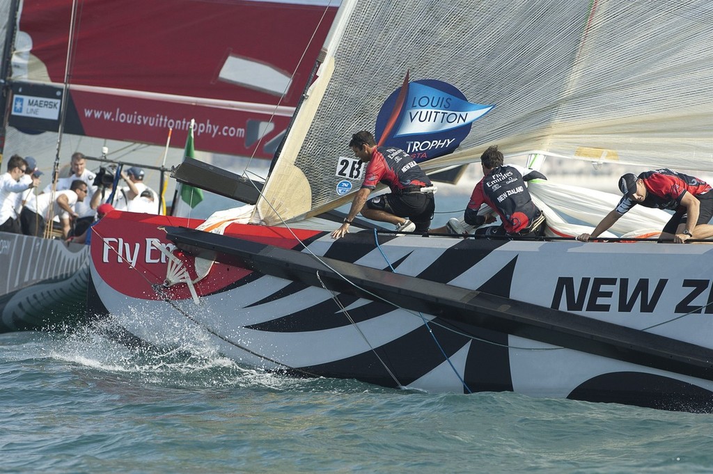 Emirates Team New Zealand retreive their splintered spinnaker pole. Gavin Brady gets a double penalty for Mascalzone Latino (ITA) in this collision in race two. Day one of the Louis Vuitton Dubai regatta. 14/11/2010/11/2010 &copy; Chris Cameron/ETNZ http://www.chriscameron.co.nz