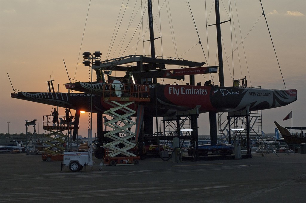 Emirates Team New Zealand boatbuilders go to work on the damage to the hull of NZL84. Louis Vuitton Dubai Trophy regatta. 14/11/2010 &copy; Chris Cameron/ETNZ http://www.chriscameron.co.nz