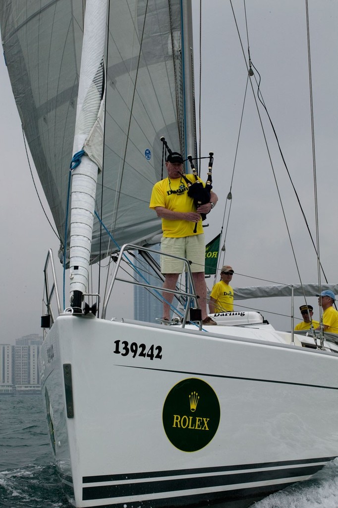 Rolex China Sea Race 2010. Gareth Williams, the Phantom Piper of the China Sea, plays Darling out of the harbour ©  RHKYC/Guy Nowell http://www.guynowell.com/