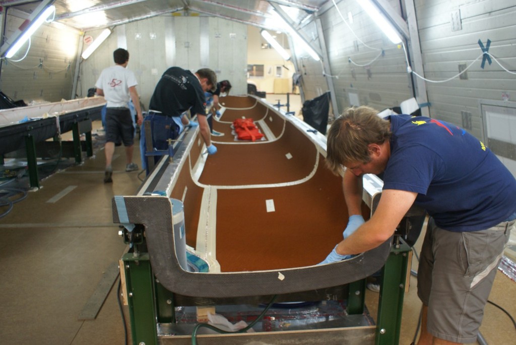 First hull being laid up in mould - AC 45 construction - Core Builders, Warkworth, November 2010 © Richard Gladwell www.photosport.co.nz