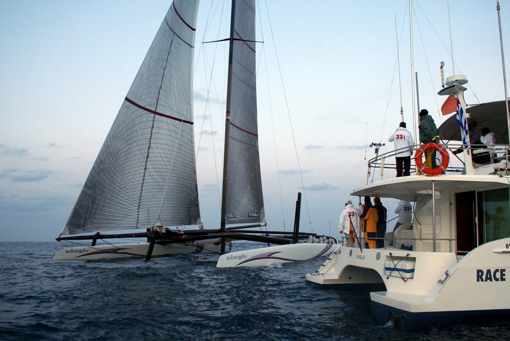 Alinghi 5 finishes second in the final race of the 33rd America’s Cup as SNG’s Vice Commodore, Fred Meyer (stern in while jacket looks on). © Richard Gladwell www.photosport.co.nz