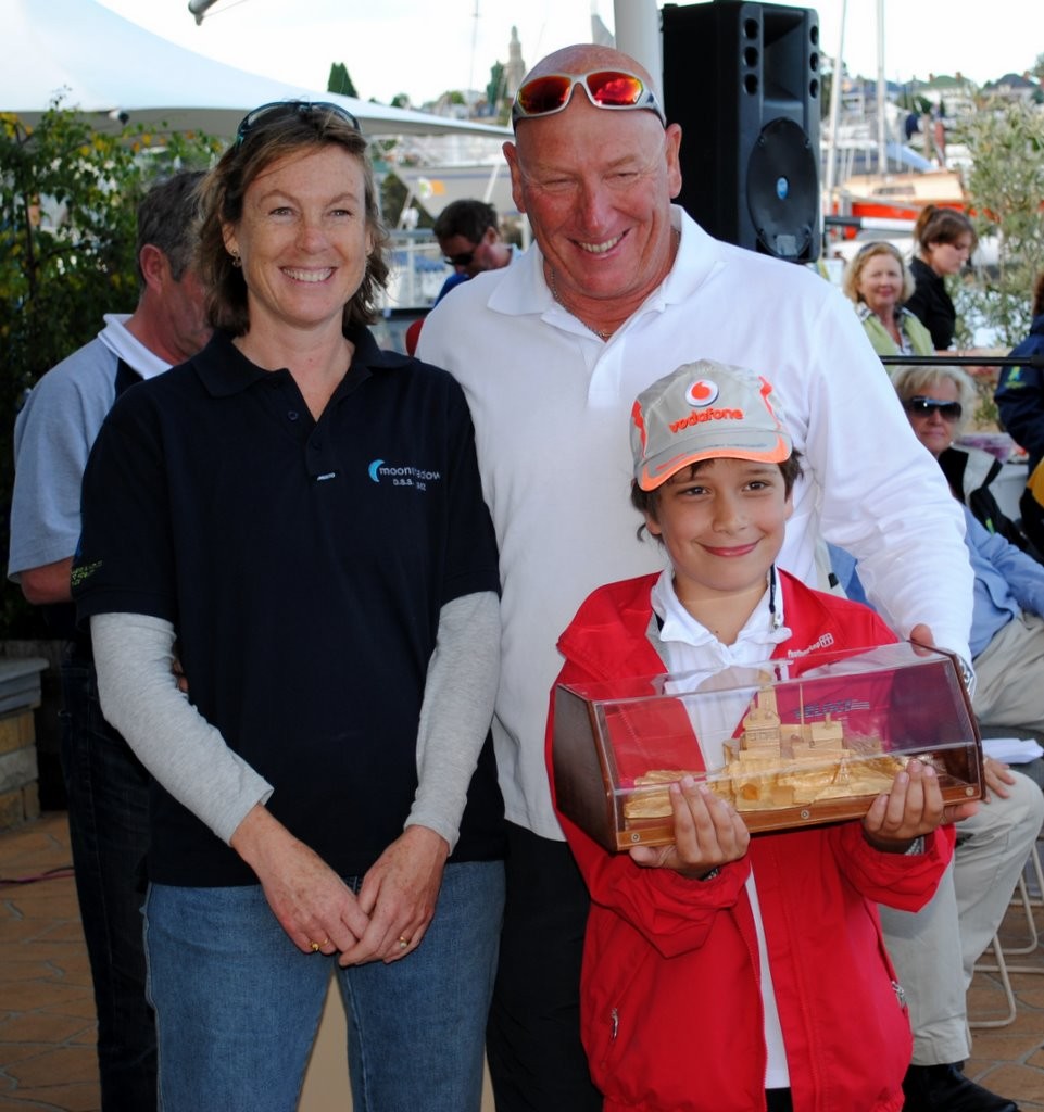 Phil Simpfendorfer and his son receive the Salamanca Series trophy from Trish Halley of Heemskirk Consolidated, sponsors to the Melbourne to Hobart races ©  Andrea Francolini Photography http://www.afrancolini.com/