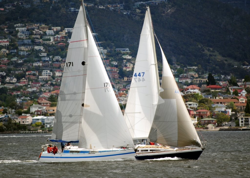 Atilla (John Hunn) and Galapagos Duck (Terry Bragg) race to the finish line in the Bellerive Yacht Club’s first pennant race of the season on Hobart’s River Derwent. - Bellerive Yacht Club opening pennant day photo copyright  Andrea Francolini Photography http://www.afrancolini.com/ taken at  and featuring the  class