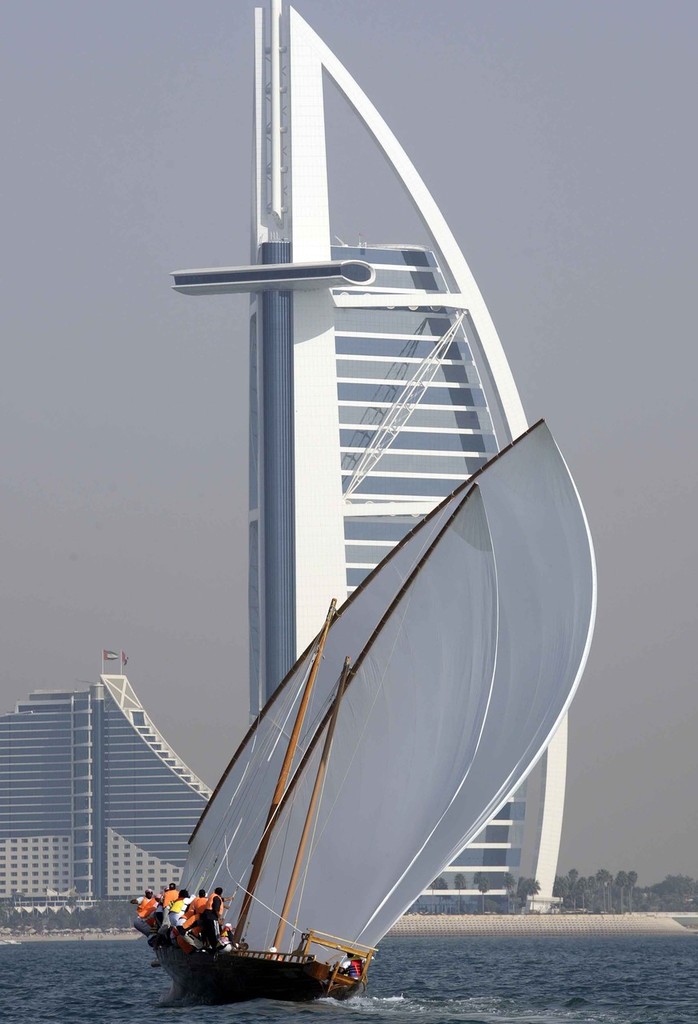 Dubai Traditional 60ft Dhow Sailing Championships. Sailing in front of 'The Sail'. photo copyright Ashraf Al Amra / DIMC taken at  and featuring the  class