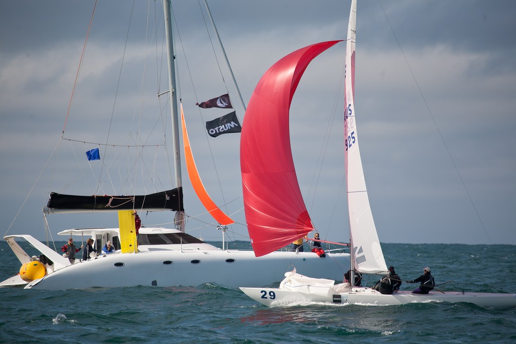 Tom King (Iron Lotus) crossing the line in 13th, race 5, to secure a regatta win. Etchells Australasian Winter Championship 2011 © Kylie Wilson Positive Image - copyright http://www.positiveimage.com.au/etchells