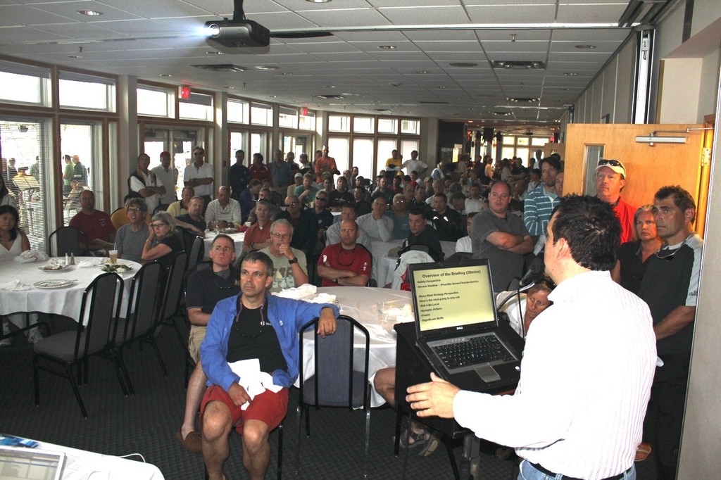 An attentive crowd listens in as Ron Bianchi shares his insight on the weather © Guy Perrin http://sail-world.com