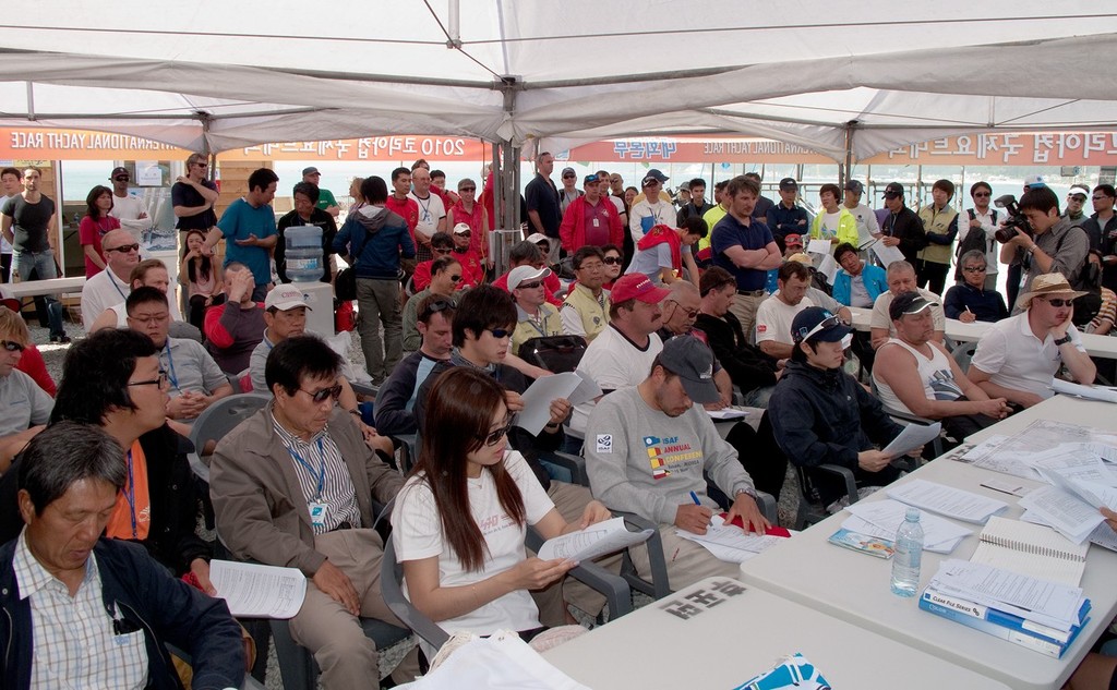 Eyes down for a line - Skippers’ Briefing - Korea Cup 2010 © Guy Nowell http://www.guynowell.com