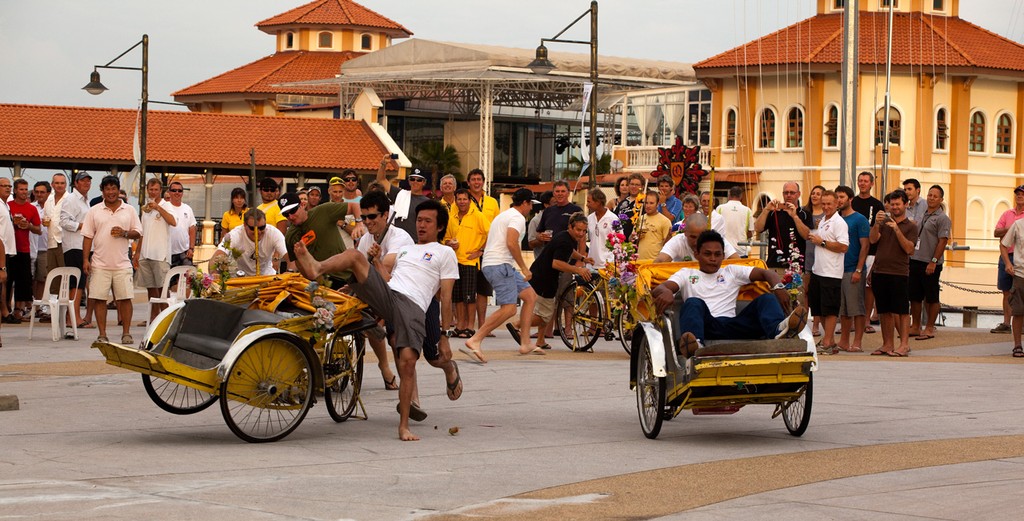 RMSIR_2010 - Penang Trishaw Races. Innovative mounting tachnique. This is going to hurt.  © Guy Nowell http://www.guynowell.com