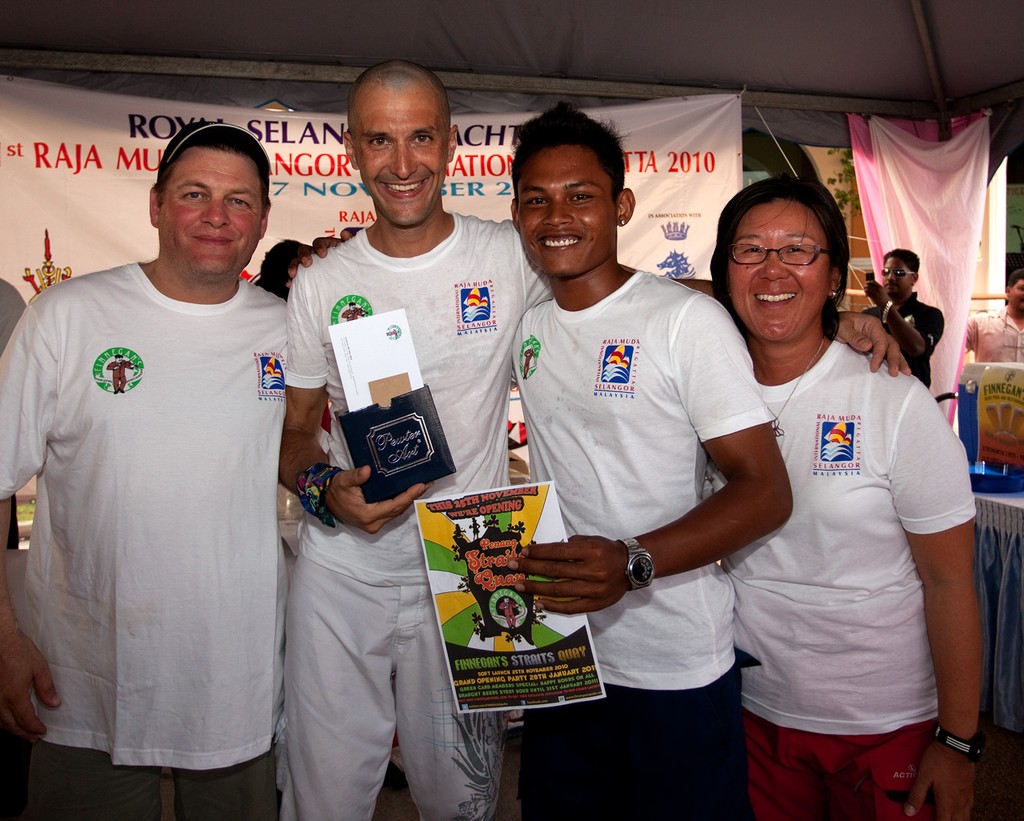 RMSIR_2010 - Penang Trishaw Races. Happy winners uphold crew honour. © Guy Nowell http://www.guynowell.com