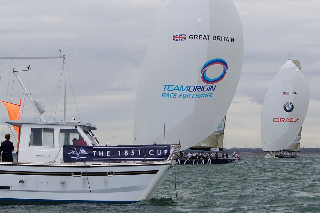 ENGLAND, Cowes, 4th August 2010. 1851 Cup Regatta. Day 2. TEAMORIGIN leads BMW Oracle Racing to the finish. © Ian Roman/TEAMORIGIN www.ianroman.com