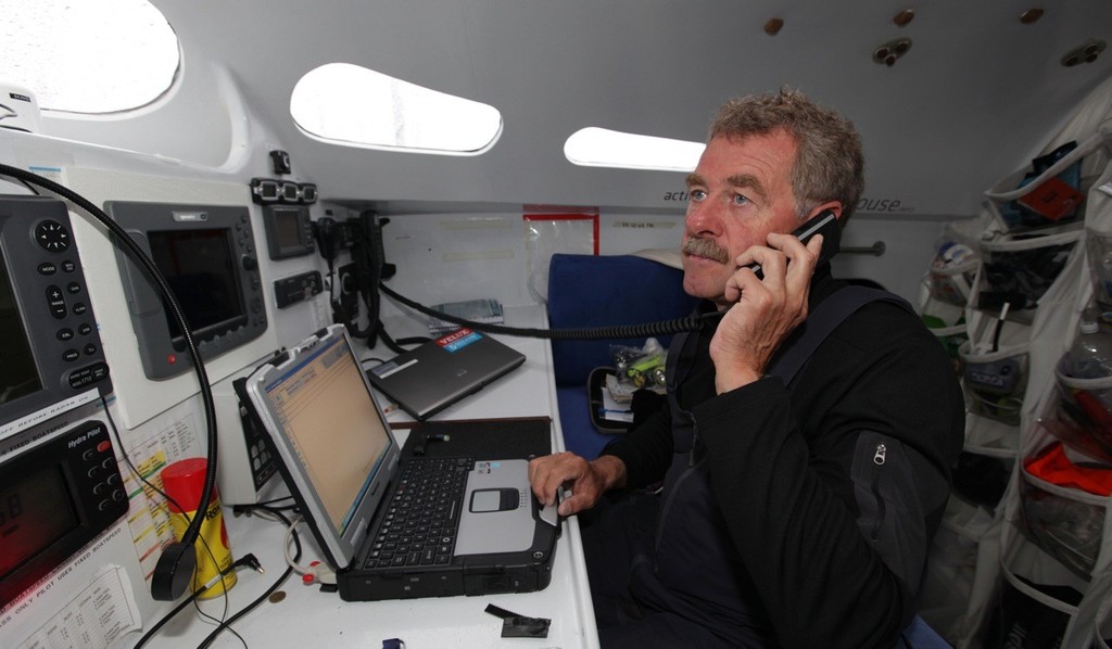Below deck using the satellite phone © Velux 5 Oceans 