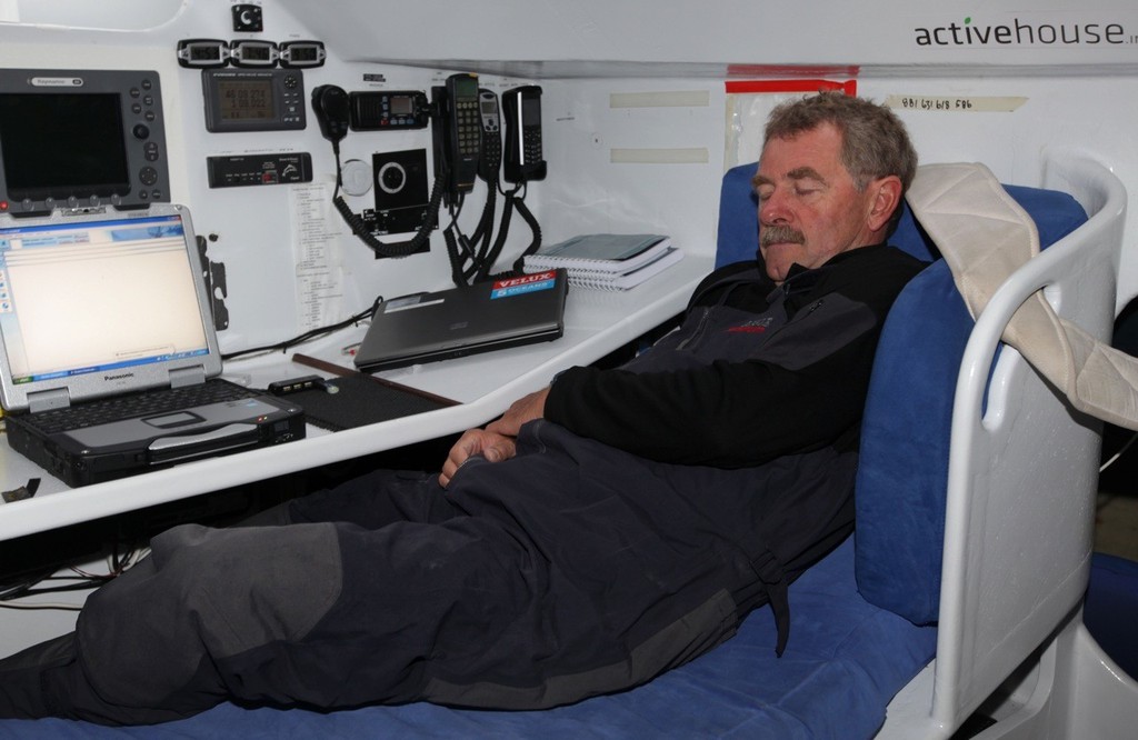 Derek resting in the sea berth at the navigation station © Velux 5 Oceans 