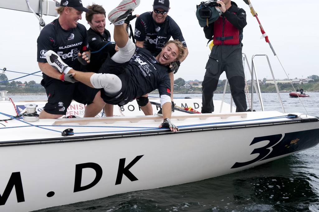 Local crew Jonas Frank Hviid-Nielsen. who crewed aboard BlackMatch racing gets the winner&rsquo;s dunking at the Danish Open 2010, Bornholm, Denmark. World Match Racing Tour. photo copyright Loris von Siebenthal http://www.myimage.ch taken at  and featuring the  class