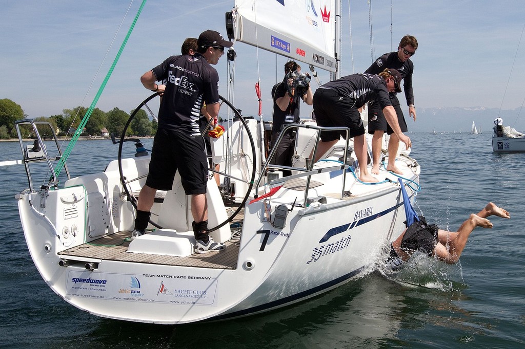 Black Match bowman Nick Blackman gets the wedgie of his life after his team members threw him in the water after winning Match Race Germany 2010. World Match Racing Tour. Langenargen, Germany. 24 May 2010. Photo: Gareth Cooke/Subzero Images/WMRT photo copyright WMRT http://www.worldmatchracingtour.com taken at  and featuring the  class