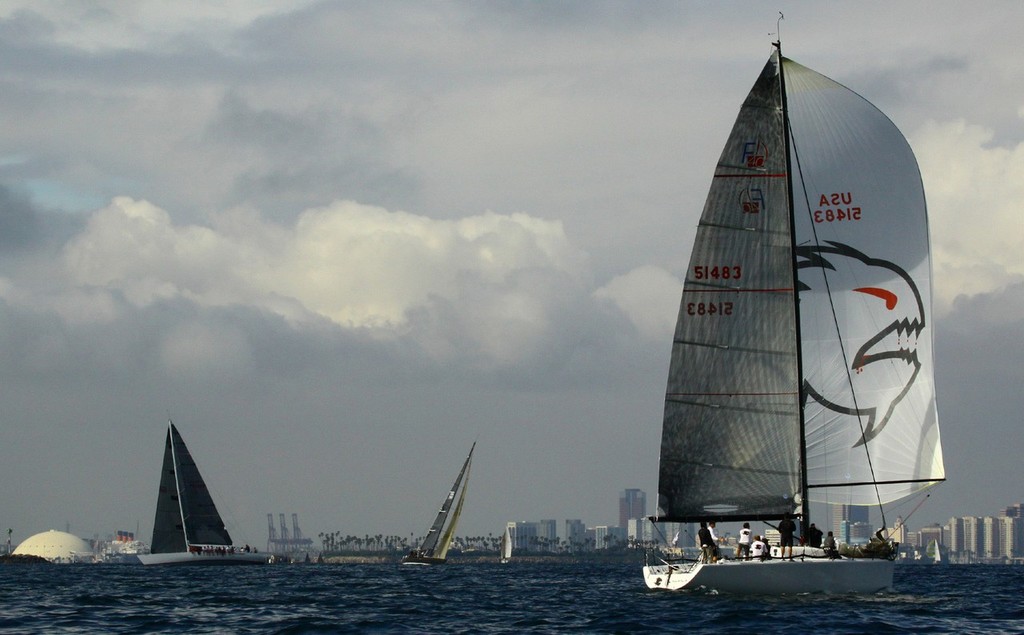 David Voss’ Farr 40 Piranha leads the fleet against the cloudy Long Beach skyline, taking first place honors in his class in the 2010 Campbell Cup. © Rick Roberts 
