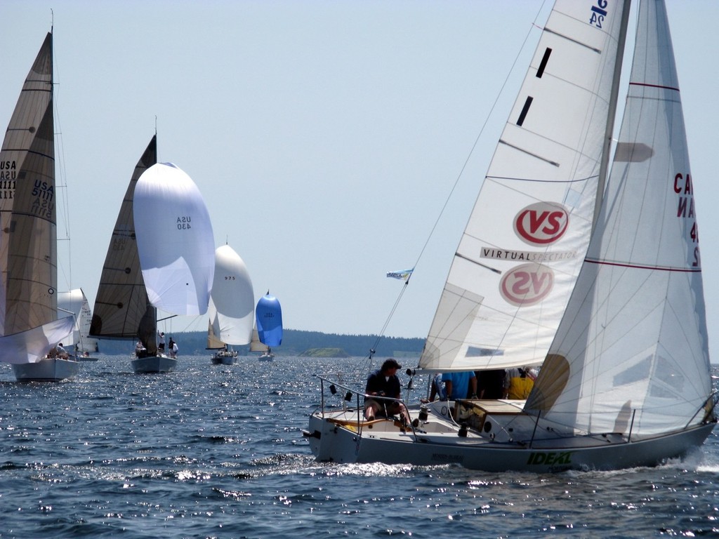 A Class ocean racers run down wind to the mark while the J 24 Class head back upwind for the final leg of their race © Ryan Cameron