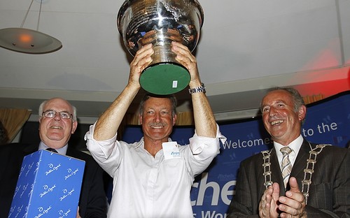 Bertrand holds the cup high - Etchells Worlds 2010 Howth Ireland  © Ingrid Abery http://www.ingridabery.com
