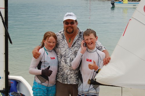 10 year old sister Carmen, Team Manager and Proud Dad Brian with Patrick who is on the phone to Optimum, Kelly, in NZ. © Brian Haybittle