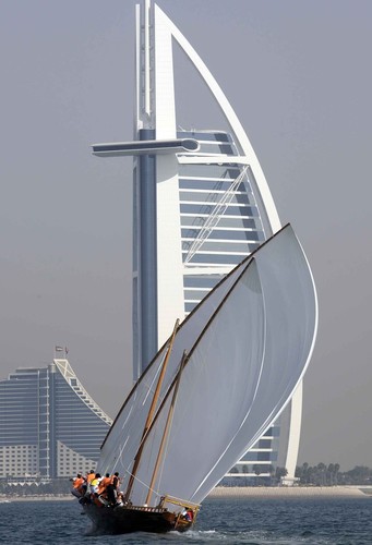 Dubai Traditional 60ft Dhow Sailing Championships. Sailing in front of ’The Sail’.  © Ashraf Al Amra / DIMC