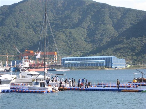 Boat Show marina with shipyard in background. © AIMEX 