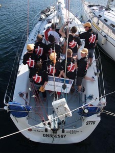 Chikara Outlaw's crew were pretty happy with their crew shirts at the end of the 2009 Eastcoaster race. - Melbourne to King Island photo copyright  John Curnow taken at  and featuring the  class