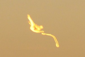 Is it a bird or a plane? Cropped close up of satellite (?) hitting Tasman Sea photo copyright Peter Idoine taken at  and featuring the  class