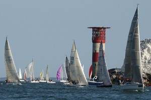 The fleet of 1,754 boats round the Needles on the Isle of Wight during the J.P. Morgan Asset Management Round the Island Race 2010.
 photo copyright onEdition http://www.onEdition.com taken at  and featuring the  class