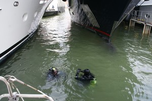 Ships divers remove struts on Dockwise photo copyright Ian & Andrea Treleaven taken at  and featuring the  class