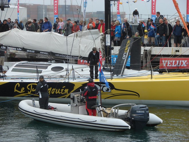 Extra crew assist Brad Van Liew to the start of the Ocean Sprint 3 in Wellington on Sunday. - Velux 5 Oceans © Genevieve Howard