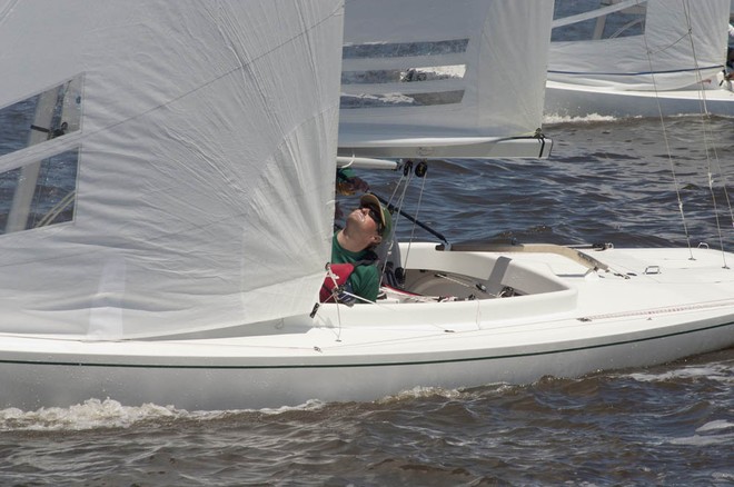 Valentin Uvarkin trimming aboard Murka 12. - Dragon Worlds &copy;  John Curnow