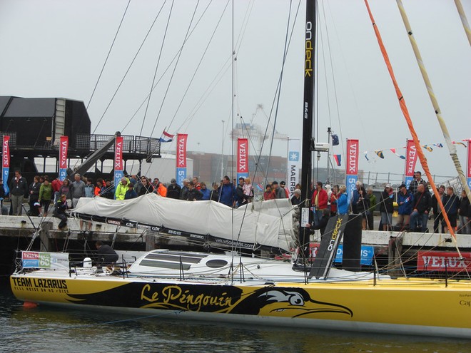 Extra crew assist Brad Van Liew to the start of the Ocean Sprint 3 in Wellington on Sunday. - Velux 5 Oceans © Genevieve Howard