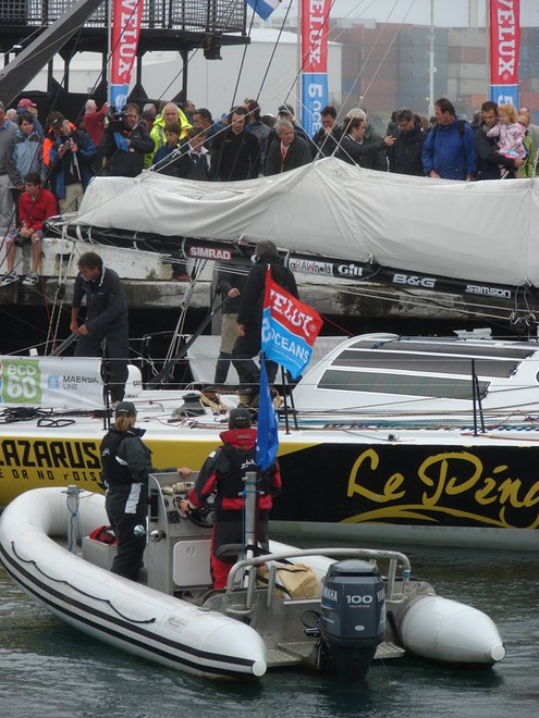 Extra crew assist Brad Van Liew to the start of the Ocean Sprint 3 in Wellington on Sunday. - Velux 5 Oceans © Genevieve Howard
