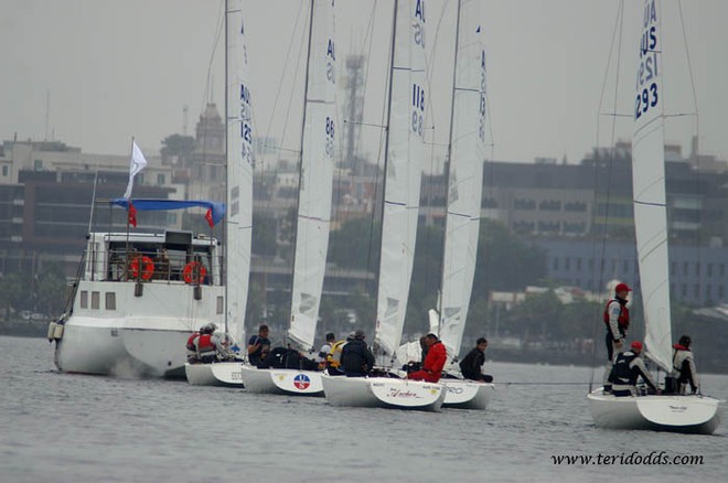 The dying breeze meant for a shortened course, and a grateful tow in for many. - Rex Gorell Prestige Etchells Australian Championships 2011 &copy; Teri Dodds http://www.teridodds.com