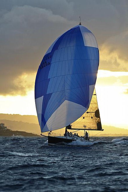 The J/145 BAD PAK sailed by Tom Holthus and crew surfing to finish line off Diamond Head - Transpac Race 2011 © Phil Uhl