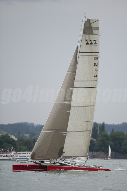 2011 June 17, Lindau Germany Rund Um,  a race with lot of rain, the winner is the Swiss Multihull Holy Smoke of Andreas Schiesser, build 1989. Despite his age he managed to beat all the modern multihulls. © Juerg Kaufmann go4image.com http://www.go4image.com