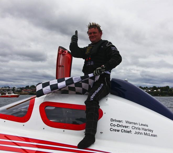 Warren Lewis winning driver of ’fairview’ recieves the chequered flag - Round One of the Rayglass NZ Offshore Powerboat Series<br />
Thunder on the Lake - Taupo  January 22nd 2011<br />
 © Cathy Vercoe LuvMyBoat.com http://www.luvmyboat.com
