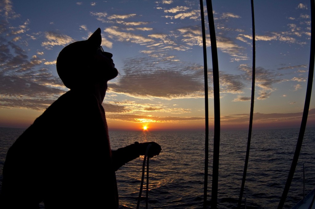 Paul Hermanson trims spin as the sun goes down wide shot - 103rd Race to Mackinac © Sean Palizza