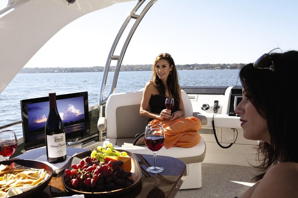 Pretty ladies, a bottle of bubbly and Sea Ray's 450 Sedan Bridge- does it get any better than this? photo copyright Sea Ray Boats . taken at  and featuring the  class
