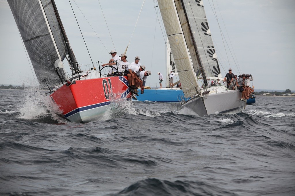 Paul Eldrid and Scott Disley's General Lee emerges from a mark rounding narrowly ahead of The Next Factor. - Geographe Bay Race Week 2011 © Bernie Kaaks - copyright