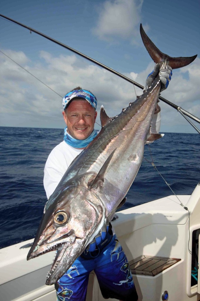 The author displays a solid Dogtooth tuna caught while jigging the deep. photo copyright Jarrod Day taken at  and featuring the  class