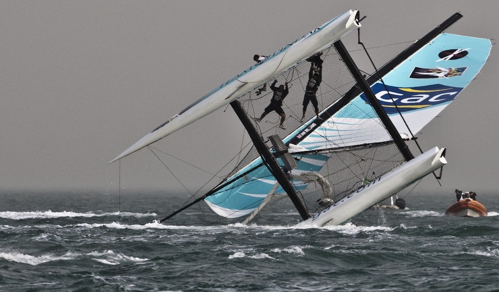  Team GAC Pindar capsizes in the final race  - Extreme Sailing 2011 - Day 3, Qingdao © Giordana Pipornetti