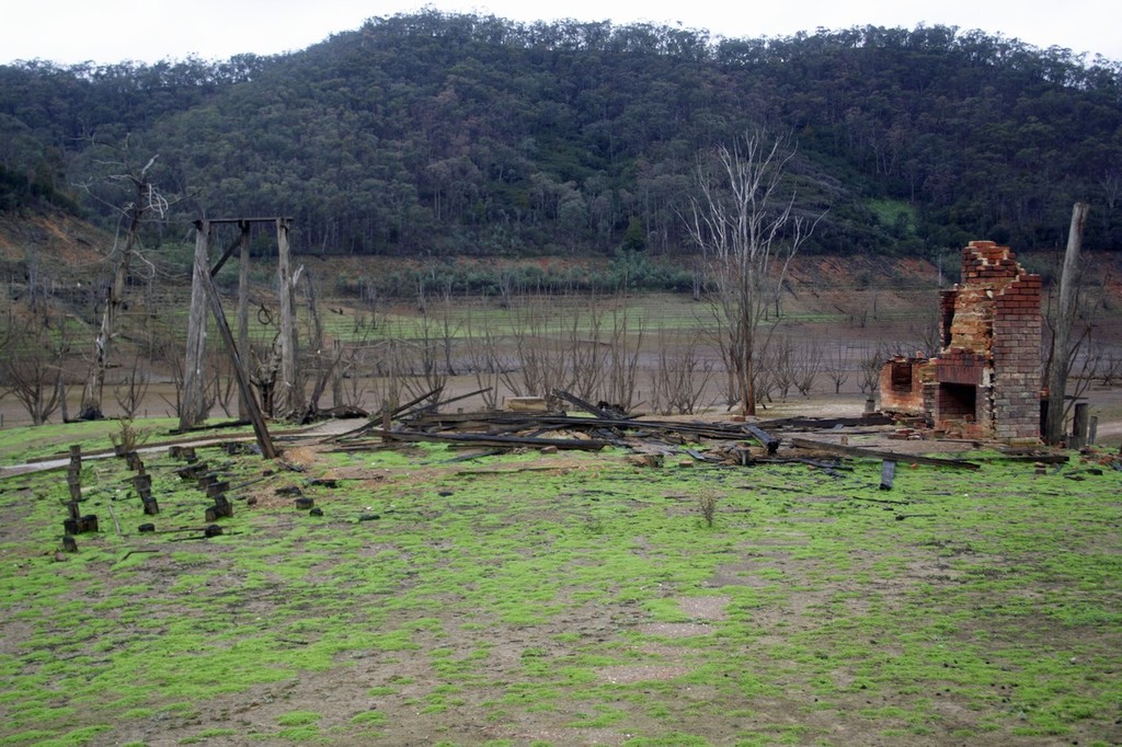 The once exposed homestead is now fully covered with water. No doubt there will be trout hiding amongst the timber. © Jarrod Day